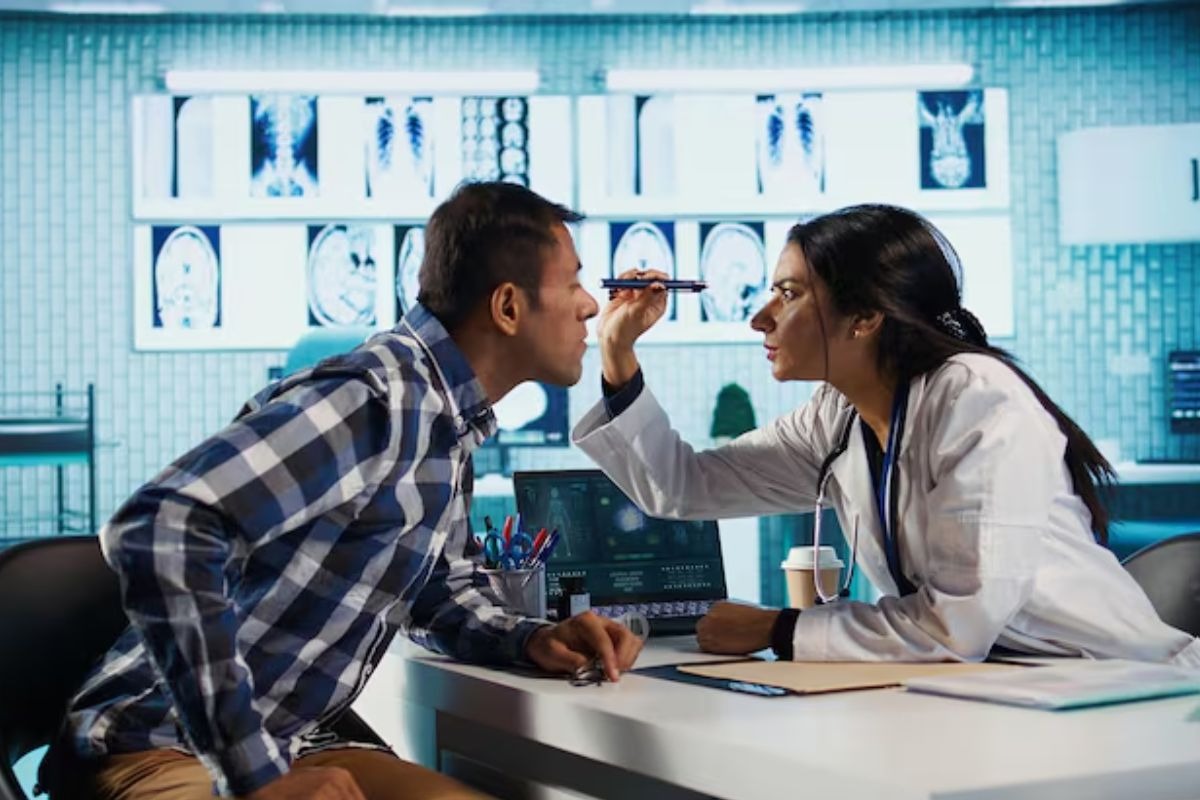 ophthalmologist examining a patient's eyes during a comprehensive eye exam to identify vision and eye health concerns.