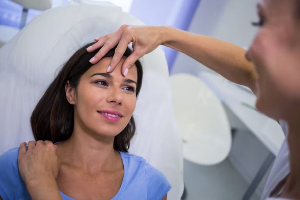 patient receiving a post-laser surgery eye examination during a follow-up recovery visit.