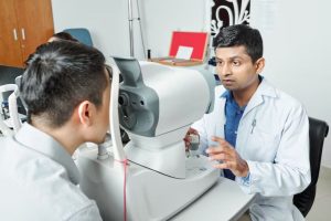eye doctor examining a patient for laser vision correction.
