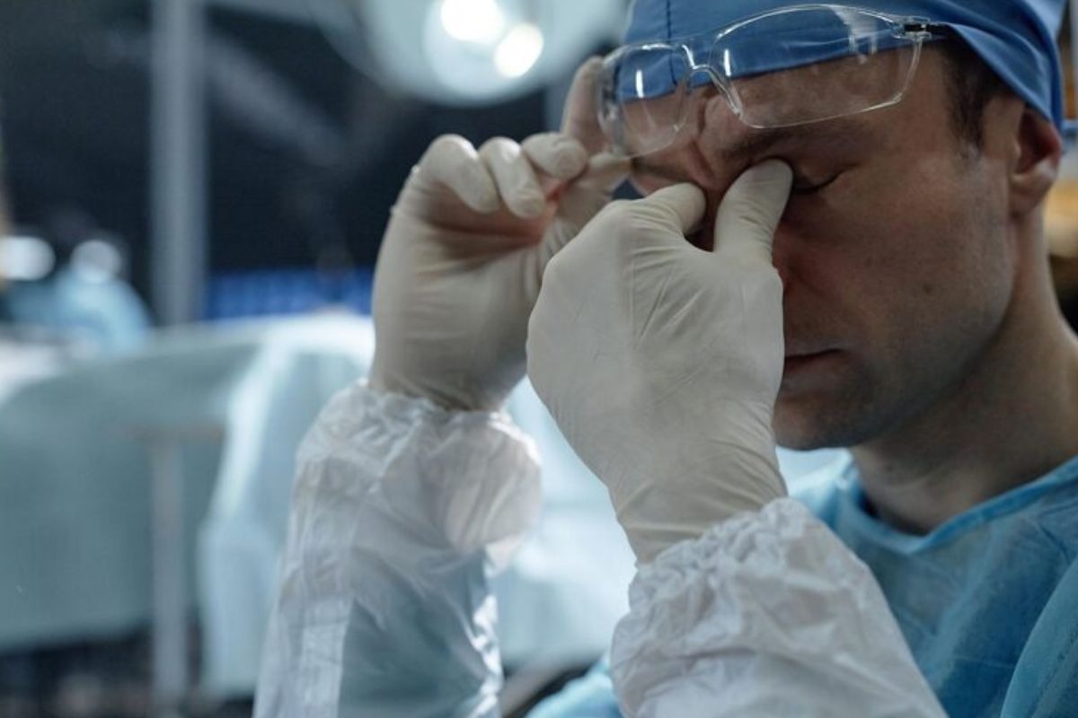 retina surgery specialist examining a patient’s eye during an eye care procedure.